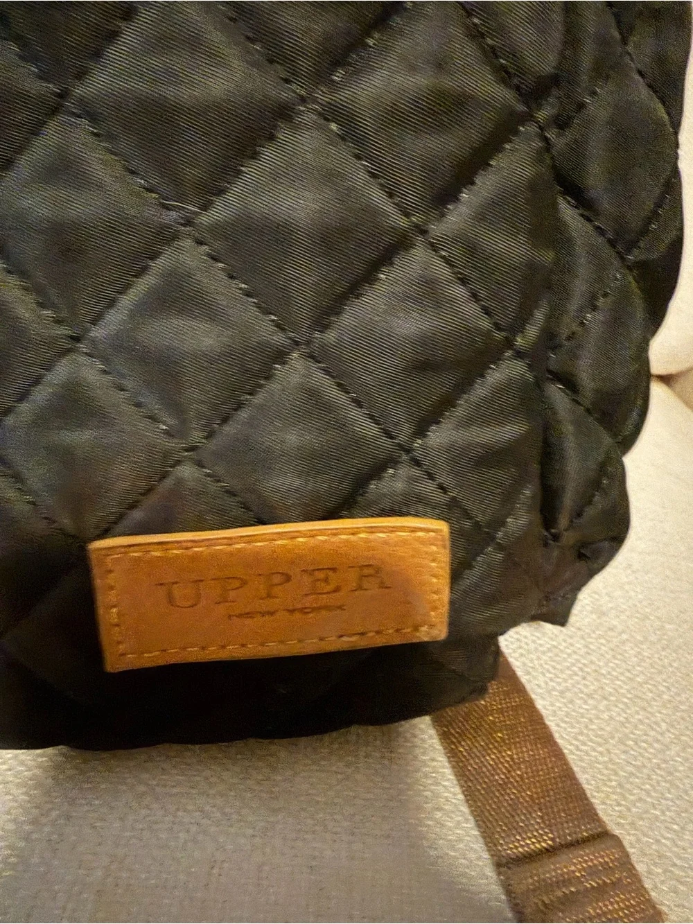 Quilted Black Women's Backpack with Tan Trim Accents